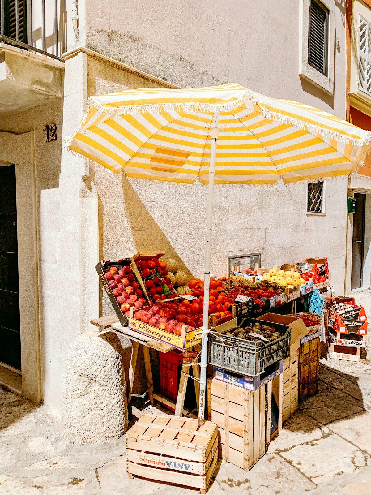 A colourful produce stall at a daytime market