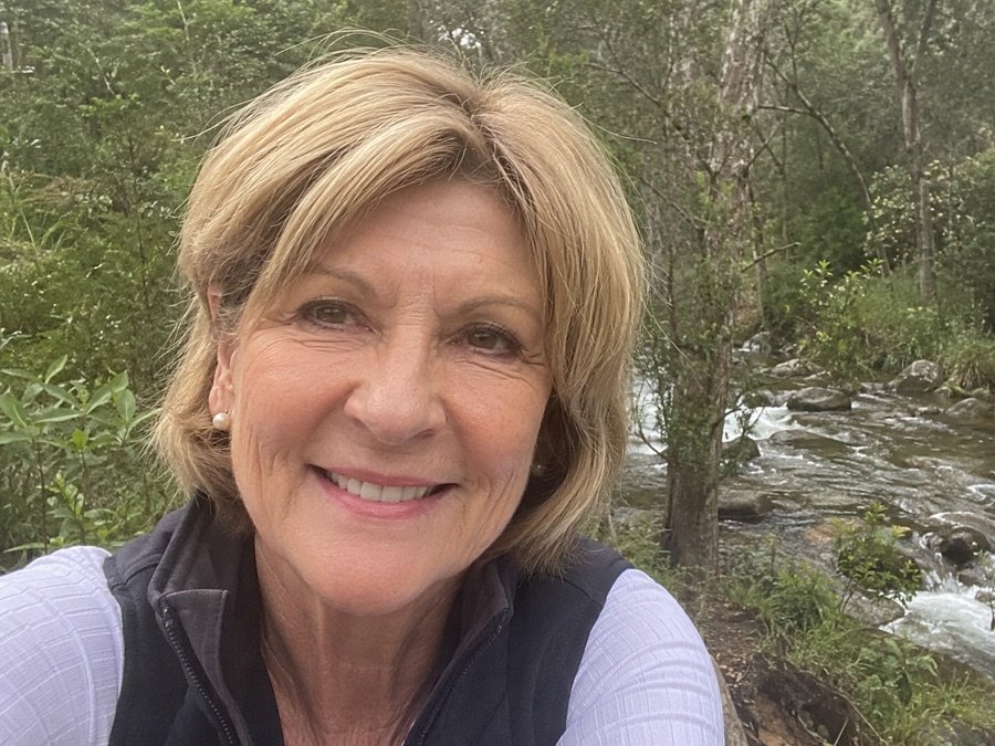 Helen Taylor outdoors beside a creek